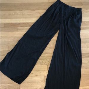 High waisted black silk pants.